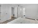 This bedroom features white walls, light-colored floors, and multiple doorways at 3428 Ivys Walk, Atlanta, GA 30340