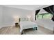 Cozy bedroom with a queen bed, hardwood floors, and a bright window view at 3428 Ivys Walk, Atlanta, GA 30340