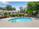 Community outdoor swimming pool surrounded by lounge chairs and a lush landscape at 3428 Ivys Walk, Atlanta, GA 30340