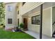 Charming home entrance with well-kept lawn, leading to a covered porch and stylish front door at 3428 Ivys Walk, Atlanta, GA 30340