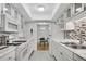 Eat-in kitchen with updated appliances, countertops, and mosaic tile backsplash at 3428 Ivys Walk, Atlanta, GA 30340