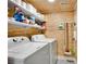 Laundry room with washer, dryer, shelving and wood paneling at 3428 Ivys Walk, Atlanta, GA 30340