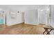 Open-concept living area with hardwood floors and a view of the front door, creating an inviting space at 3428 Ivys Walk, Atlanta, GA 30340