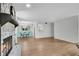Spacious living room with hardwood floors and a stone fireplace open to the dining area at 3428 Ivys Walk, Atlanta, GA 30340