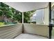 Covered outdoor patio offers a view of the private backyard and mature trees at 3428 Ivys Walk, Atlanta, GA 30340