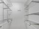 Walk-in closet features ample shelving space for storage at 3428 Ivys Walk, Atlanta, GA 30340