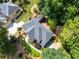 Aerial view of a well-maintained home with landscaped grounds and a private backyard at 570 Hunt River Way, Suwanee, GA 30024