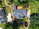 Beautiful aerial view of a well-maintained home with mature trees, landscaped yard and charming walkway at 570 Hunt River Way, Suwanee, GA 30024