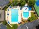 Overhead shot of a pristine swimming pool, pool and surrounding patio at 570 Hunt River Way, Suwanee, GA 30024