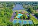 Community recreation area features pool, tennis courts, playground and lush landscaping at 570 Hunt River Way, Suwanee, GA 30024