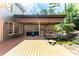 Inviting outdoor space with covered patio, a waterfall, and comfortable seating, perfect for relaxing at 570 Hunt River Way, Suwanee, GA 30024