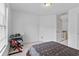 Carpeted bedroom with window, desk and chair, and neutral walls at 570 Hunt River Way, Suwanee, GA 30024