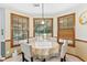 Cozy dining area featuring natural light and a view to the backyard at 570 Hunt River Way, Suwanee, GA 30024