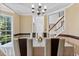 Bright dining room with windows, crown molding, and seating for Gathering dinners at 570 Hunt River Way, Suwanee, GA 30024