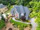 Stunning home featuring a stone walkway and lush landscaping enhancing curb appeal at 570 Hunt River Way, Suwanee, GA 30024