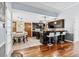 Open-concept kitchen featuring a breakfast bar, adjacent dining area, and views of the living space at 570 Hunt River Way, Suwanee, GA 30024