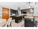 Functional kitchen with an island, stainless steel appliances, dark cabinets, and a breakfast bar at 570 Hunt River Way, Suwanee, GA 30024