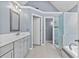 Main bathroom features a double sink vanity and separate tub and shower at 570 Hunt River Way, Suwanee, GA 30024