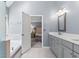 Spacious main bath features a double vanity, soaking tub and walk-in shower at 570 Hunt River Way, Suwanee, GA 30024