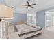 Spacious main bedroom features a trey ceiling, sitting area, and ensuite bath at 570 Hunt River Way, Suwanee, GA 30024