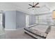 Main bedroom features a trey ceiling, carpet, and ensuite bathroom at 570 Hunt River Way, Suwanee, GA 30024