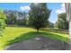 Large backyard features a well-maintained lawn and a charming wooden fence at 2806 Vintage Wood Nw Way, Kennesaw, GA 30144