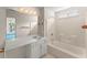 Bright bathroom features a shower-tub combo and integrated vanity at 2806 Vintage Wood Nw Way, Kennesaw, GA 30144