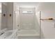 Bright bathroom features a shower-tub combo and an integrated vanity at 2806 Vintage Wood Nw Way, Kennesaw, GA 30144