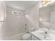 A bathroom featuring a tub-shower combination, toilet, and a single sink vanity with modern fixtures at 2806 Vintage Wood Nw Way, Kennesaw, GA 30144