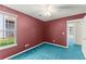 Comfortable bedroom with blue carpet, a ceiling fan, and a view of the outdoors at 2806 Vintage Wood Nw Way, Kennesaw, GA 30144