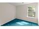 Well-lit bedroom with a view from the window and comfortable blue carpeting at 2806 Vintage Wood Nw Way, Kennesaw, GA 30144