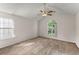 Bedroom features vaulted ceiling, ceiling fan, and wood look flooring at 2806 Vintage Wood Nw Way, Kennesaw, GA 30144