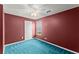 Cozy bedroom featuring blue carpet, a ceiling fan, and natural light from the window at 2806 Vintage Wood Nw Way, Kennesaw, GA 30144