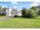 Traditional style home with manicured lawn and a two-car garage under a sunny, blue sky at 2806 Vintage Wood Nw Way, Kennesaw, GA 30144