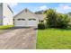 Charming single-Gathering home featuring a two-car garage and a well-maintained front yard with healthy green grass at 2806 Vintage Wood Nw Way, Kennesaw, GA 30144