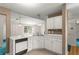 Kitchen featuring white cabinets, countertops, and a stainless-steel sink at 2806 Vintage Wood Nw Way, Kennesaw, GA 30144