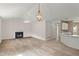 Spacious living room featuring a fireplace and view to kitchen at 2806 Vintage Wood Nw Way, Kennesaw, GA 30144