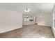 Open-concept living room featuring a vaulted ceiling and seamless access to kitchen at 2806 Vintage Wood Nw Way, Kennesaw, GA 30144