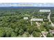 Expansive aerial view of the home surrounded by lush greenery and close to Indian Hills Golf Course in Marietta, GA at 3009 Gant Quarters Dr, Marietta, GA 30068