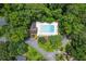 Aerial view of the neighborhood pool area, surrounded by lush trees and landscaping at 3009 Gant Quarters Dr, Marietta, GA 30068