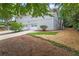 Back of the home featuring a two car garage and a stairway at 3009 Gant Quarters Dr, Marietta, GA 30068