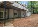 Exterior of the home with a spacious patio and stairs leading to the deck above at 3009 Gant Quarters Dr, Marietta, GA 30068
