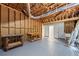 Large unfinished basement space with work benches, painted floor and exposed ceiling at 3009 Gant Quarters Dr, Marietta, GA 30068