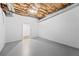 Spacious unfinished basement area with painted floors and walls, providing ample potential for customization at 3009 Gant Quarters Dr, Marietta, GA 30068