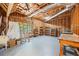 Unfinished basement space with exposed ceiling, ladder and shelving at 3009 Gant Quarters Dr, Marietta, GA 30068