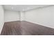Basement offers a clean and modern look with dark laminate flooring and bright, recessed lighting at 3009 Gant Quarters Dr, Marietta, GA 30068