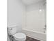 Clean white bathroom with shower/tub combo and modern toilet on plank flooring at 3009 Gant Quarters Dr, Marietta, GA 30068
