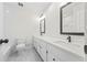Modern bathroom with double vanity, marble tile flooring, and a separate toilet and shower area at 3009 Gant Quarters Dr, Marietta, GA 30068