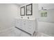Elegant bathroom with marble tile flooring, white cabinets and countertops at 3009 Gant Quarters Dr, Marietta, GA 30068