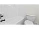 Clean bathtub and toilet in bathroom with new paint at 3009 Gant Quarters Dr, Marietta, GA 30068